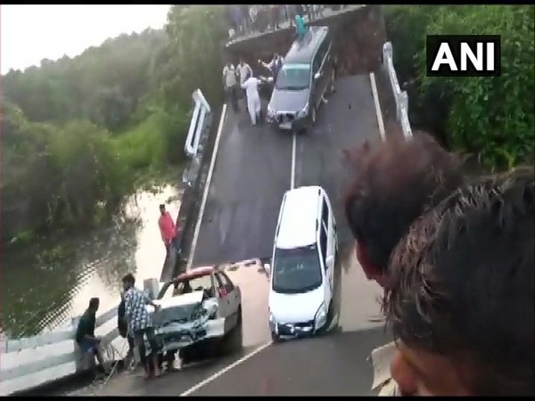 The bridge broke apart from the middle when vehicle were passing through it on Sunday. Photo/ANI