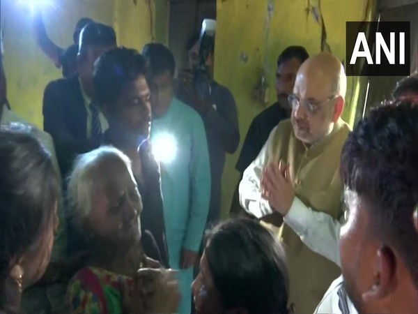 Union Home Minister Amit Shah meeting family of Bharatiya Janata Yuva Morcha (BJYM) leader Arjun Chowrasia in Kolkata's Kashipur. (ANI/photo)