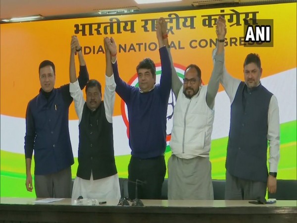 JVM MLAs Pradeep Yadav (in white jacket in pic) and  Bandhu Tirkey (in white kurta in pic) join Congress party. Photo/ANI