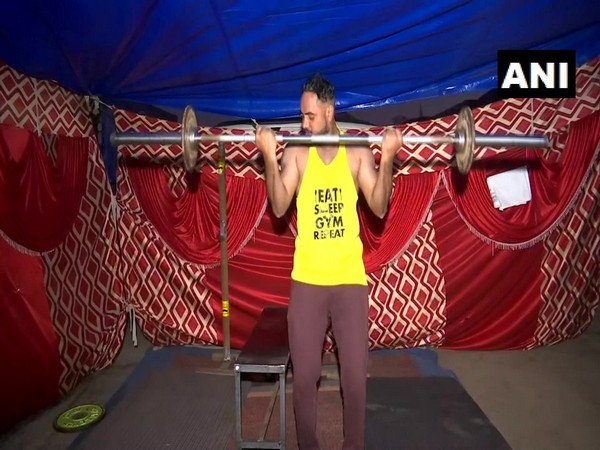 A visual of a farmer in a makeshift gym at the Singhu border. (Photo/ANI)