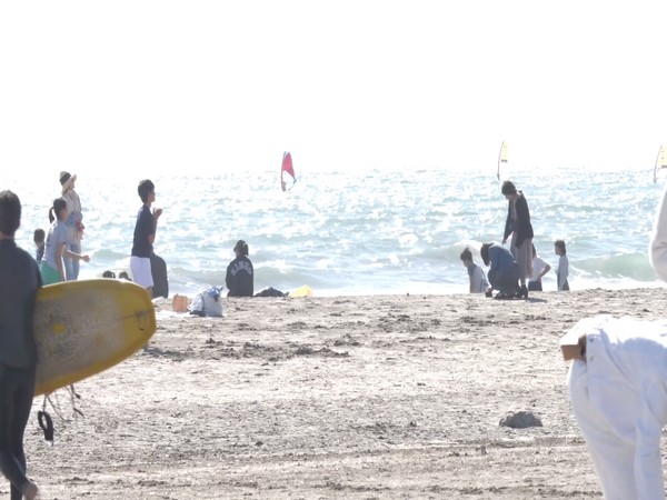 People enjoying at Kamakura Beach in Japan