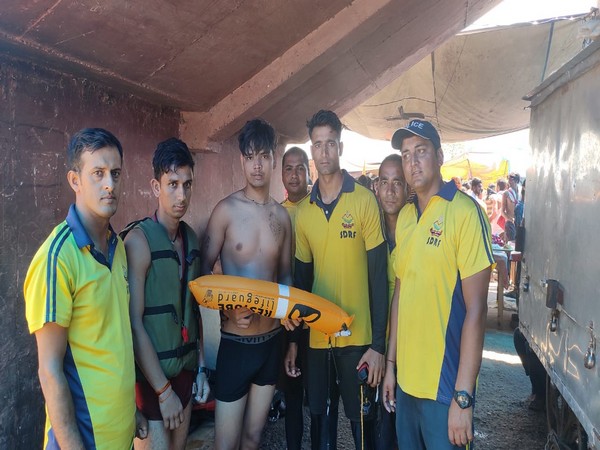 An SDRF official saved a kanwariya from drowning in Kangra Ghat in Haridwar using the life tube procured from Germany . Photo/ANI