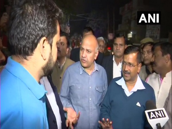 Chief Minister Arvind Kejriwal and his deputy Manish Sisodia speaking to locals in North-East Delhi on Wednesday. Photo/ANI