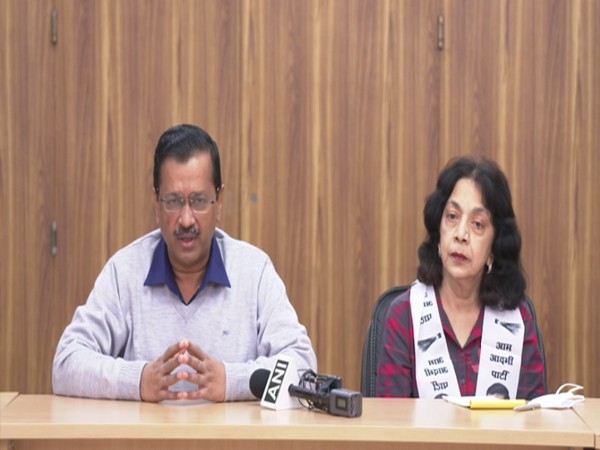 Delhi CM Arvind Kejriwal with former BJP MLA Alina Saldanha (Photo/ANI)