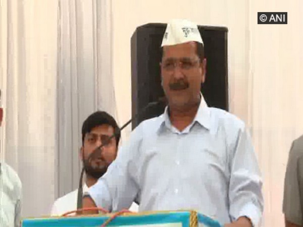 Chief Minister Arvind Kejriwal addressing a rally on Tuesday in Rohini, New Delhi.