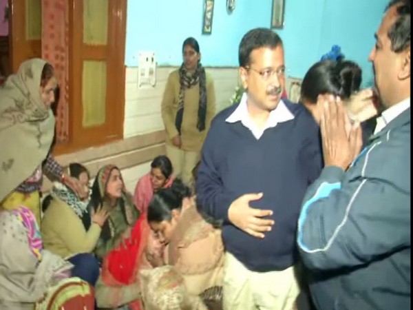 CM Arvind Kejriwal meets family members of firefighter died in Peeragarhi blaze. Phoot/ANI