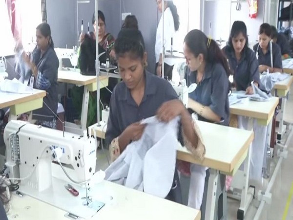 Women manufacturing clothes using Khadi in Maharashtra's Wardha on Monday. photo/ANI