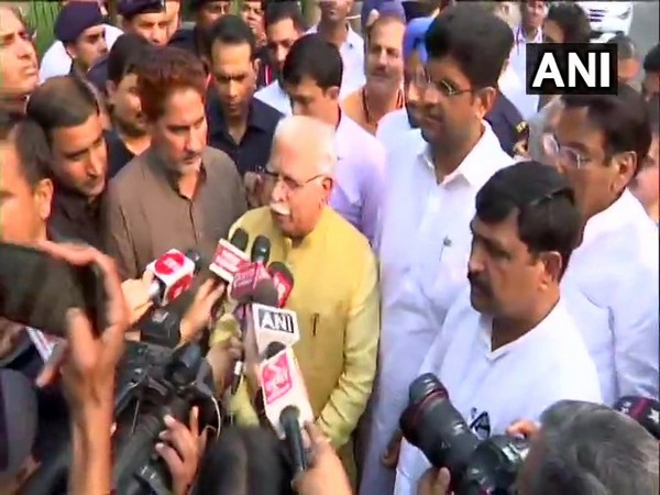 Manohar Lal Khattar and Dushyant Chautala talking to media persons after meeting Governor in Chandigarh on Saturday. Photo/ANI 