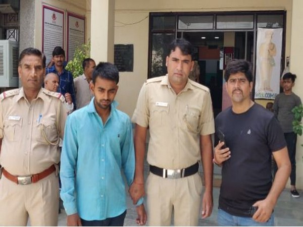 Ankit (in blue shirt) with the Delhi Police personnel in Delhi on Saturday.