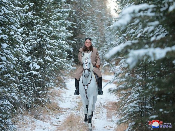 North Korean leader Kim Jong Un rides a horse during snowfall in Mount Paektu on Wednesday (Reuters)