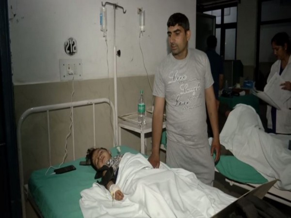 Adiba, with her relative Babar Ali at a hospital in Kishtwar on Monday. Photo/ANI