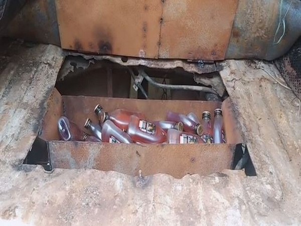 296 quarters of liquor were found hidden in a box welded to the vehicle. 