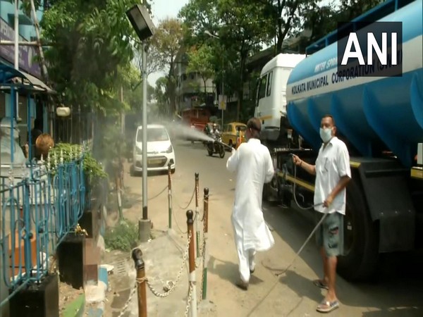 Kolkata Municipal Corporation workers conducting disinfection drive in the city amid COVID-19 lockdown on Sunday. 