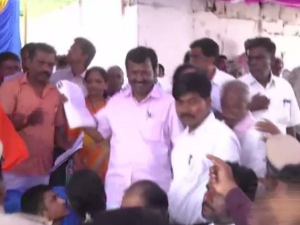 BJP MP Narayanaswamy (in pink shirt) during the event on Monday. Photo/ANI
