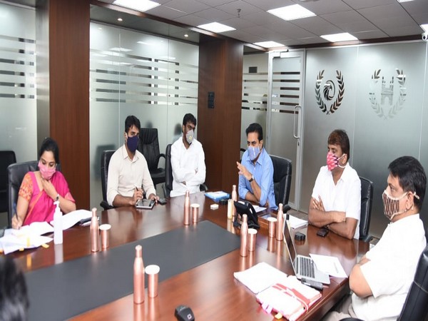 Telangana Minister KT Rama Rao with officials during review meeting on housing schemes. (Photo/ANI)