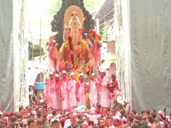 Devotees marching with Ganpati's idol in the city on Thursday. Photo/ANI