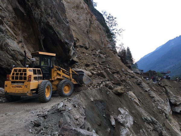 Debris and boulders lying on the route after landslide. 