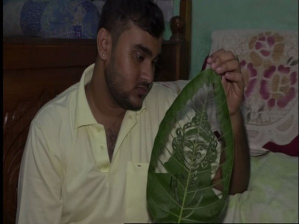 Subham Saha, the leaf artist shocased his art piece to ANI in Agartala on Friday [Photo/ANI]