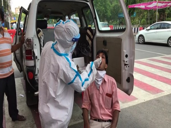 Pragya Gupta, Nurse, collecting sample of a man in Indore (ANI).