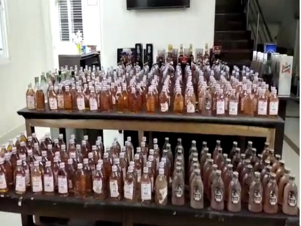 Visuals of the seized liquor bottles.