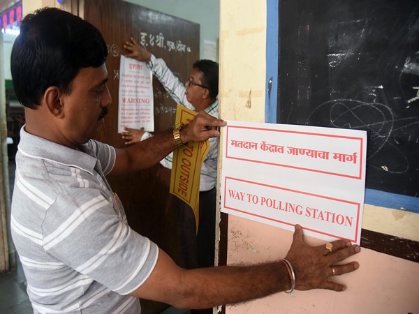 Preparations underway at a polling booth in Maharashtra for state assembly elections on Monday.