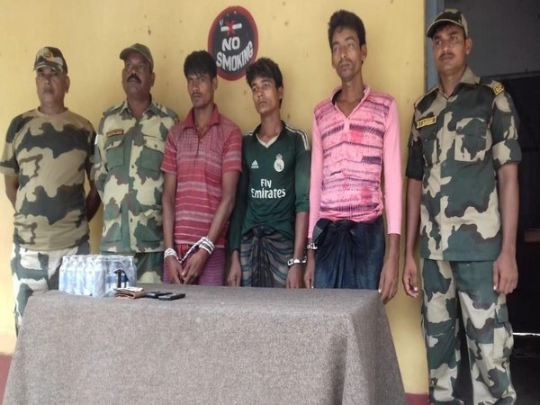 Border Security Force with three Bangladeshi national who were apprehended on Thursday Morning. (Photo/ANI)