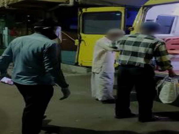 The 70-year-old COVID patient moving to quarantine facility with his son in an ambulance in Pune on Tuesday. Photo/ANI