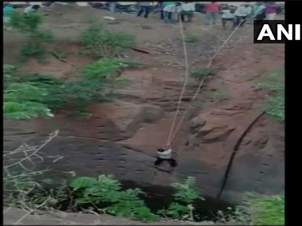 Locals help in rescuing a man who fell into a well in Mucharla Nagaram area 