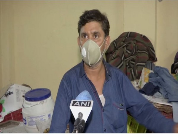 The fruit seller, Phool Mia, whose stock of mangoes was looted.