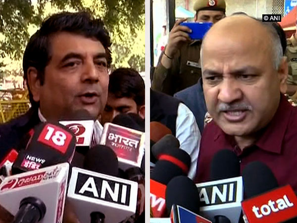 Congress leader RPN Singh and AAP leader Manish Sisodia talking to reporters outside EC office in New Delhi on Friday. (Photo/ANI)