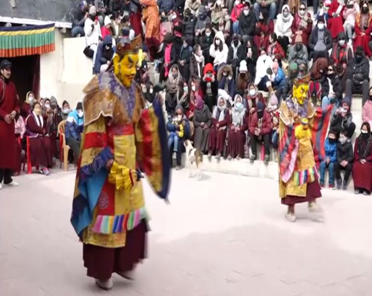 TRS Party workers wearing masks with KCR's picture on them on the occasion of party formation day in Hyderabad on Monday.  Photo/ANI