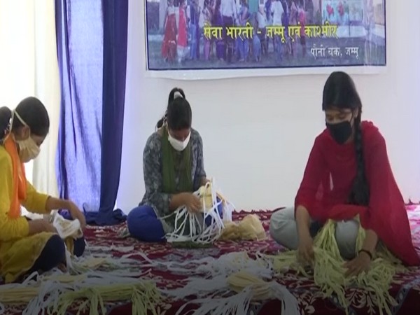 Girls make around 2,000 masks daily to contribute in fight against COVID-19 in Jammu. Photo/ ANI