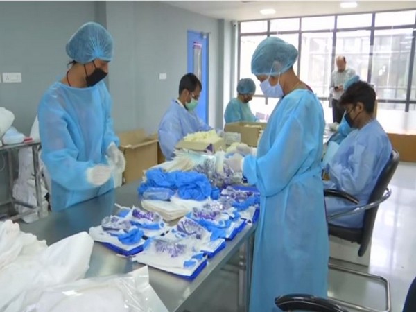 Personal Protection Kits are being manufactured by Surgilife medical devices Private Limited in Delhi. Photo/ANI