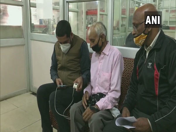 Biometeric being done of one of the pensioners