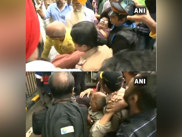 An elderly woman and man fell ill while protesting along with PMC bank depositors in Mumbai on Saturday. Photo/ANI