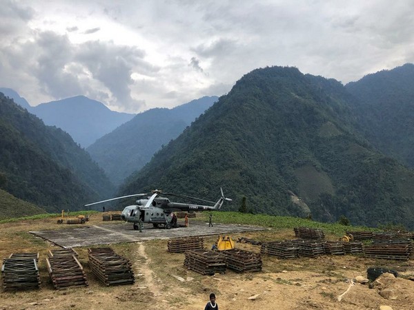 IAF's Mi-17 helicopter airlifts material for bridge construction over Kume river in Arunachal.