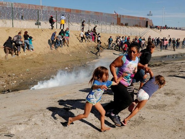 Migrants escaping tear gas at the US-Mexico border last year. (File photo)
