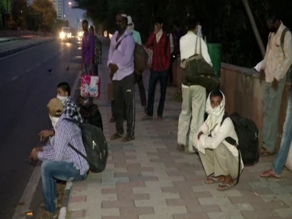 Migrant workers from UP's Gorakhpur in New Delhi on Monday.
