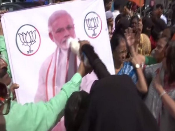 BJP leaders performing milk abhishek’ on Prime Minister Narendra Modi’s banner in Hyderabad, Telangana on Wednesday.