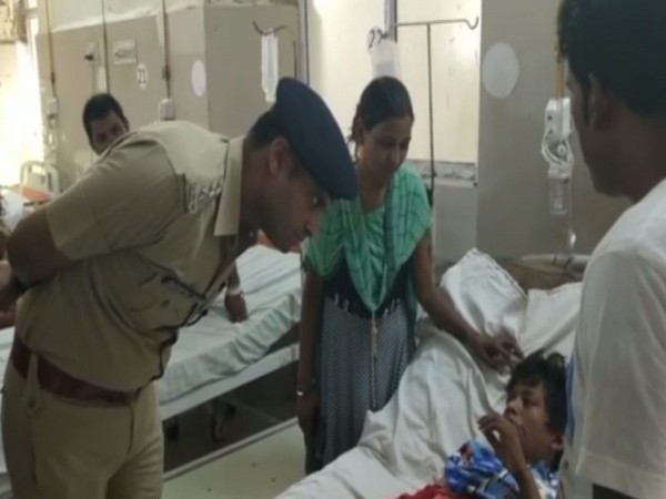 CO Swaran Singh with the victim at the hospital in Lucknow on Thursday. Photo/ANI