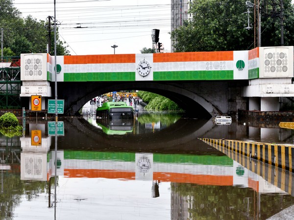 A bus was seen half-submerged on a waterlogged road under the Minto Bridge after heavy rainfall, in New Delhi on July 19. (Photo/ANI)