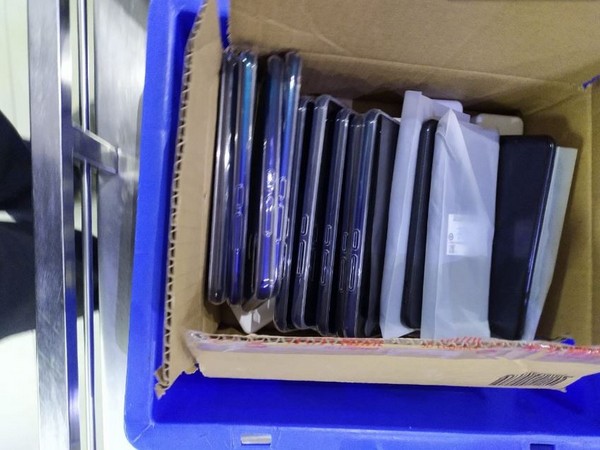 80 mobile phones were recovered by CISF from two Chinese nationals on Friday. Photo/ANI