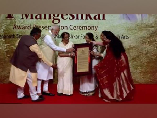 PM Narendra Modi receiving Lata Deenanath Mangeshkar Award in Mumbai. (ANI/photo)