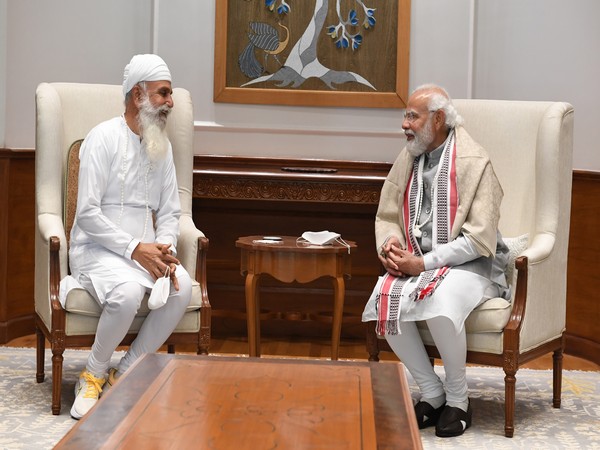 PM Narendra Modi during his meeting with Uday Singh. (ANI/photo)