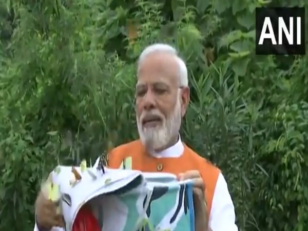 Prime Minister Narendra Modi release basket full of fluttering butterflies at the Butterfly Garden in Kevadia, Gujarat on Tuesday.
