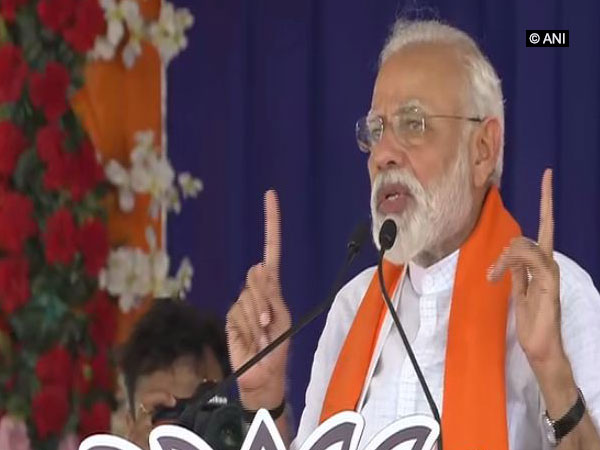 Prime Minister Narendra Modi speaking at an election rally in Songadh, Gujarat