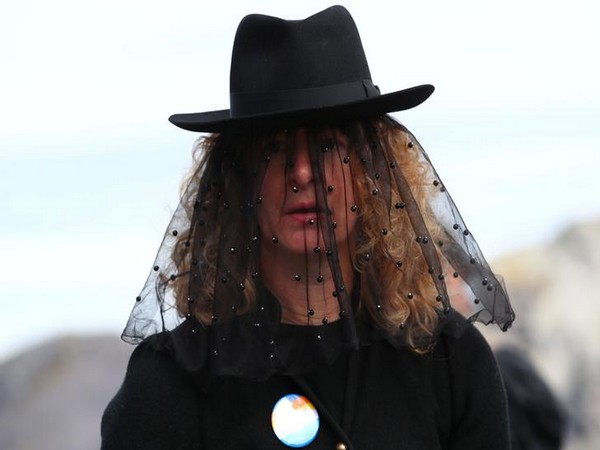 A woman attends the funeral for Pizol glacier in Switzerland on September 22 (Photo/Reuters) 
