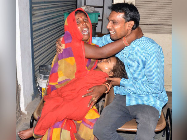 Family members mourn on the loss of their child due to Acute Encephalitis Syndrome (AES) at a hospital in Muzaffarpur. (ANI Photo)