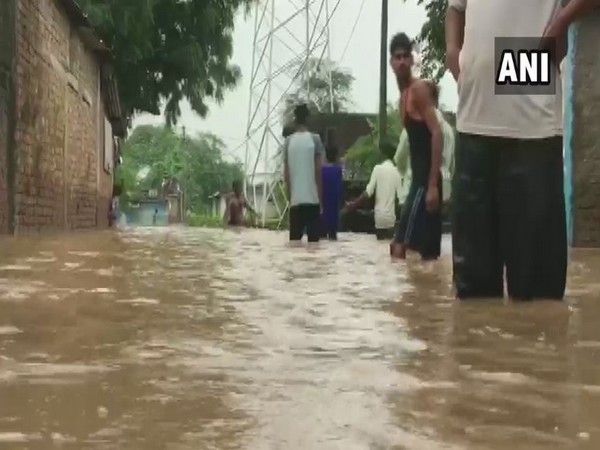 Water-logged locals of the village. (Photo/ANI)