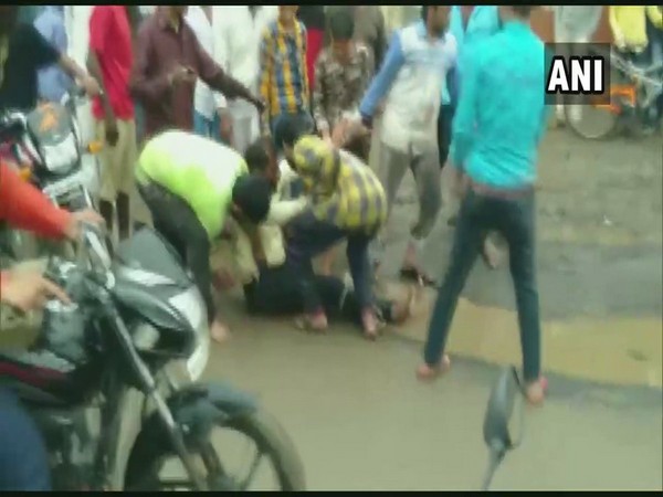 Visuals of the man being beaten up in public on Wednesday in Dewas. Photo/ANI